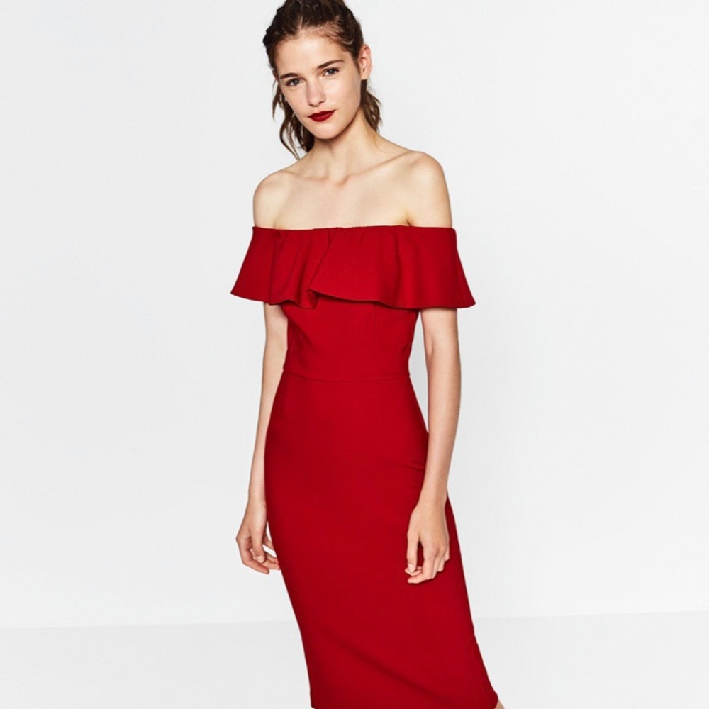 Off the shoulder red body hugging midi dress.